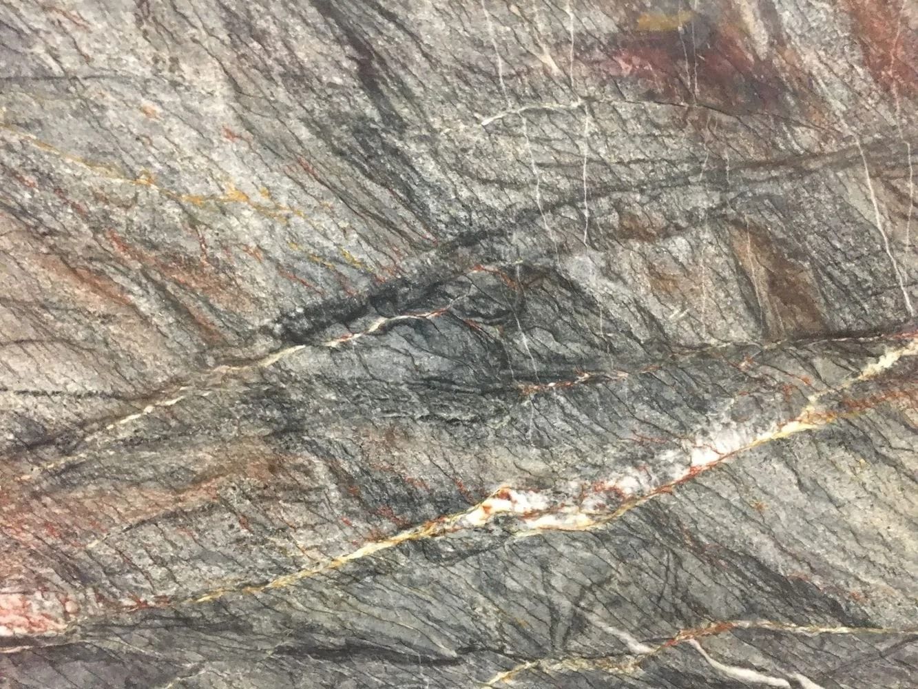 Gray, brown, and white patterned stone surface.