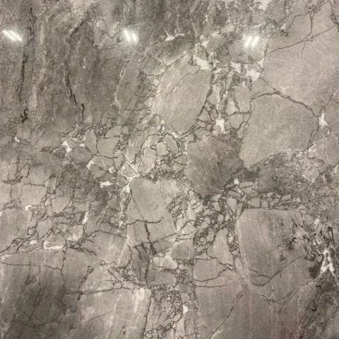 Gray marble tile with a veined, mottled pattern.