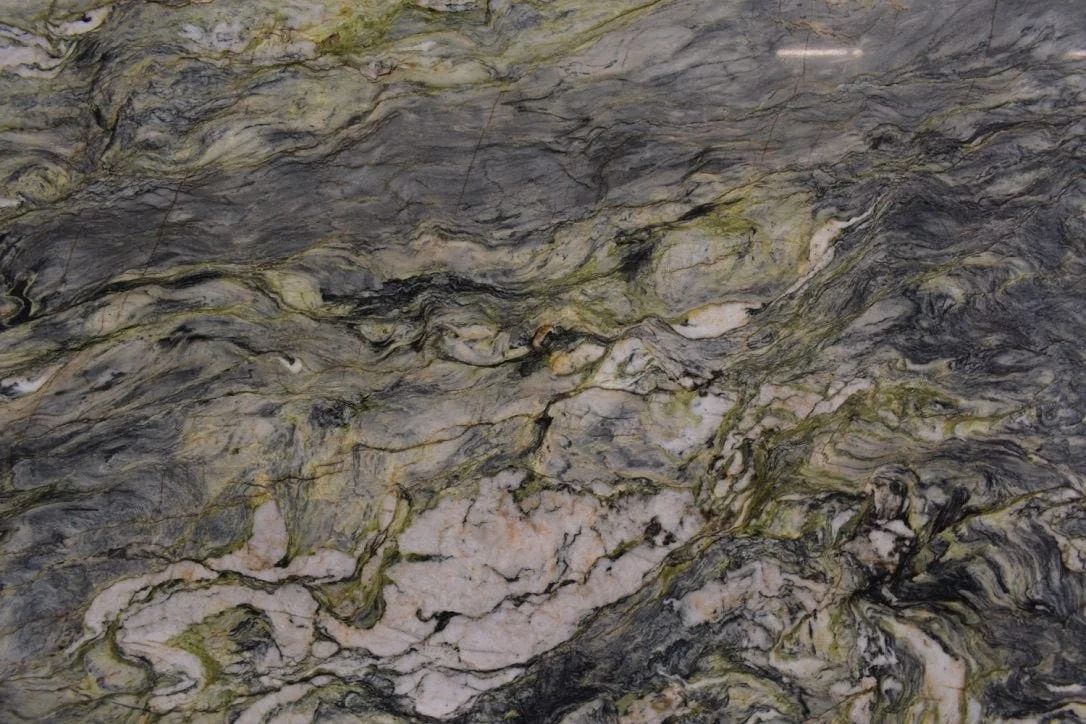 Green, gray, and white marbled stone with swirling patterns.
