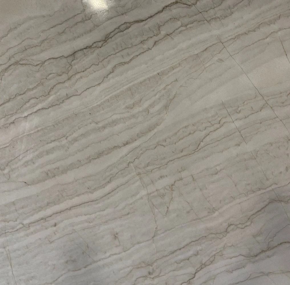 White marble floor with tan veining.