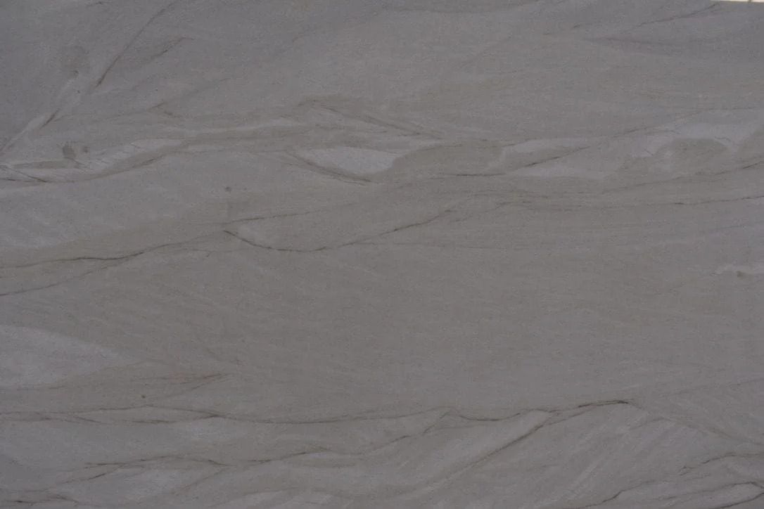 Light gray and white stone surface with subtle veining.