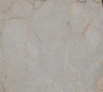 Pale beige marbled stone surface with thin brown and white veining.