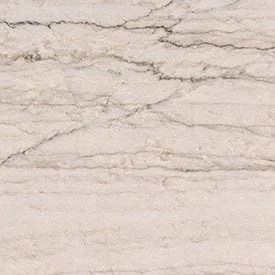 Cream-colored stone surface with dark veining and linear patterns.