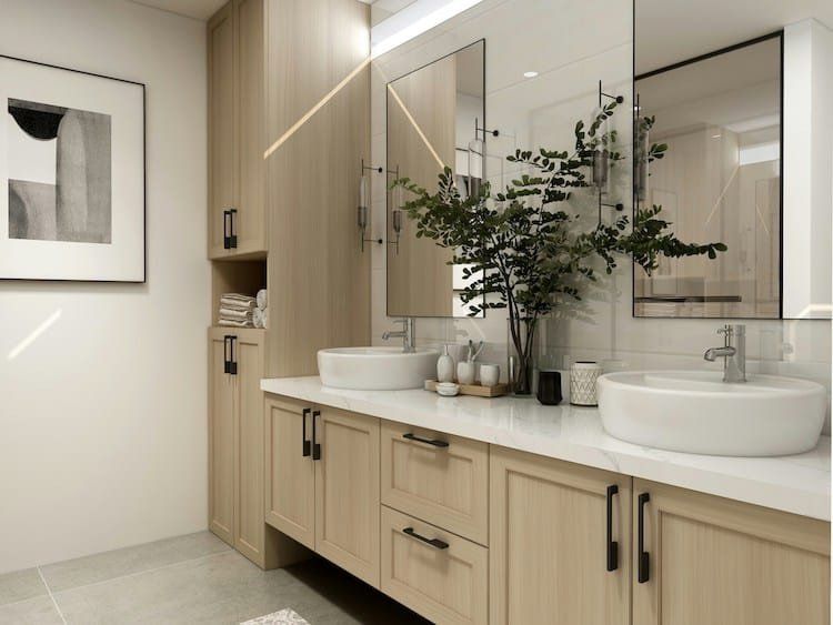 Modern bathroom with double sinks, light wood cabinets, and large mirrors.