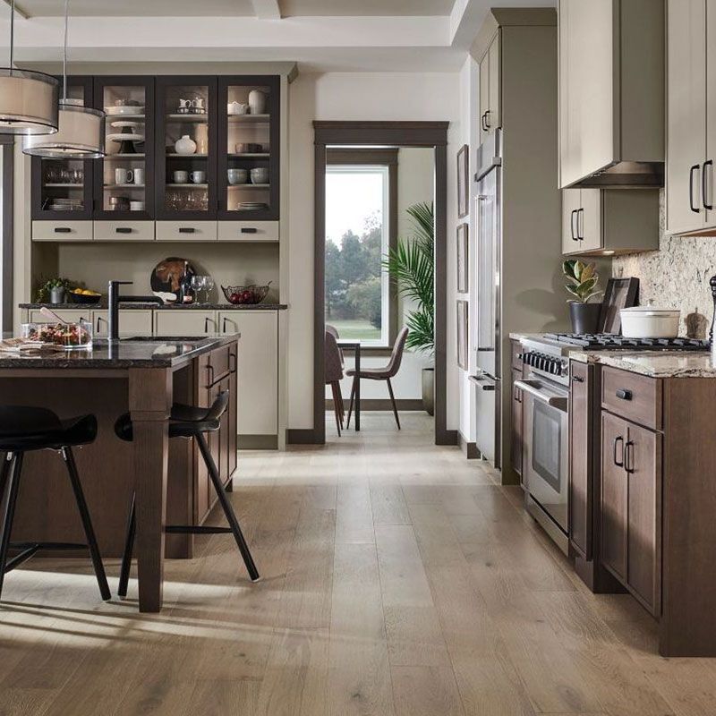 A kitchen with a large island in the middle of it
