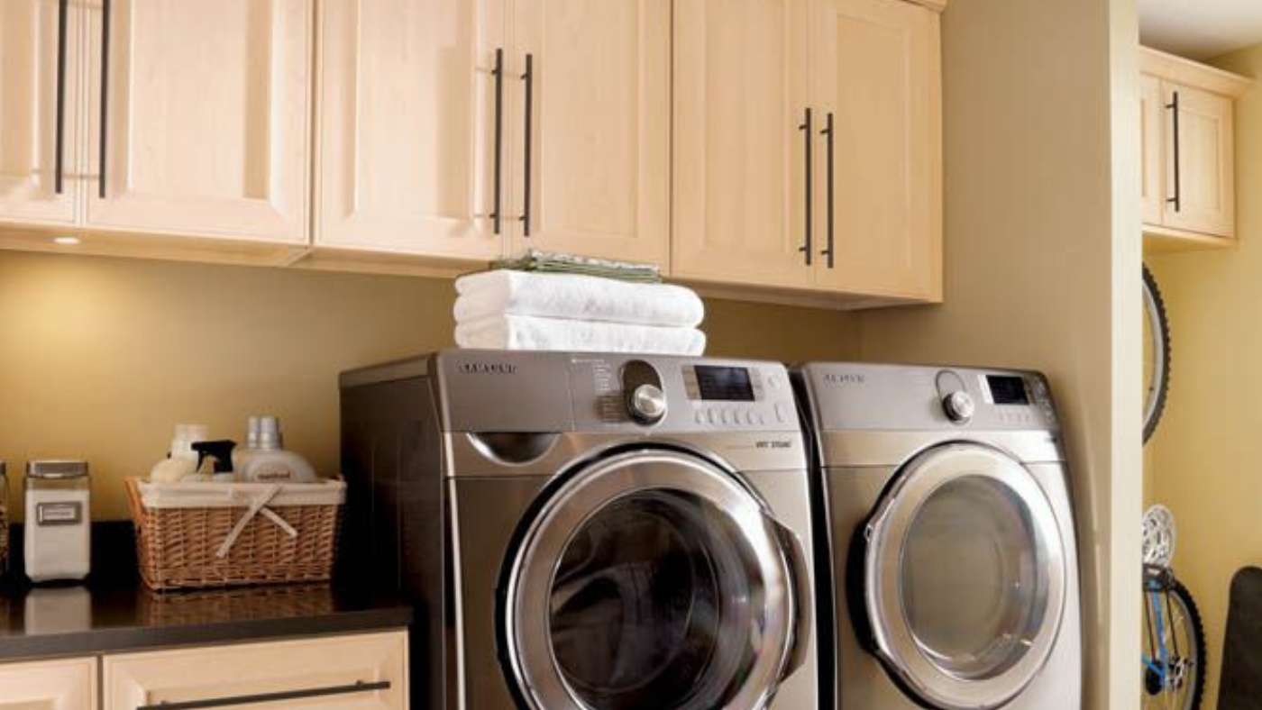 A laundry room with a washer and dryer in it