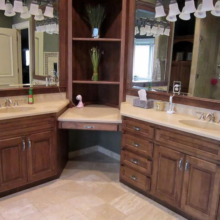 A bathroom with two sinks and two mirrors