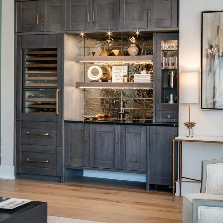 A living room with lots of cabinets and a table