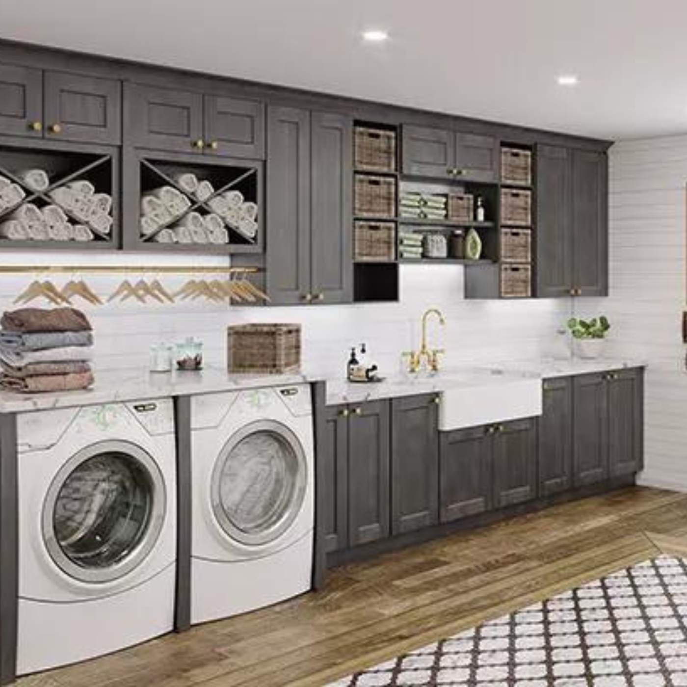 A laundry room with a washer and dryer and a sink.