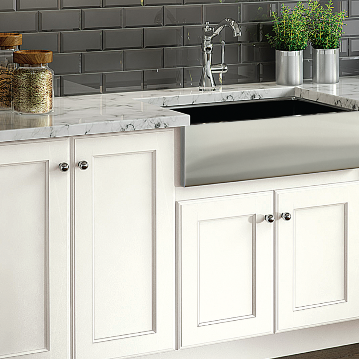 A kitchen with a stainless steel sink and white cabinets.