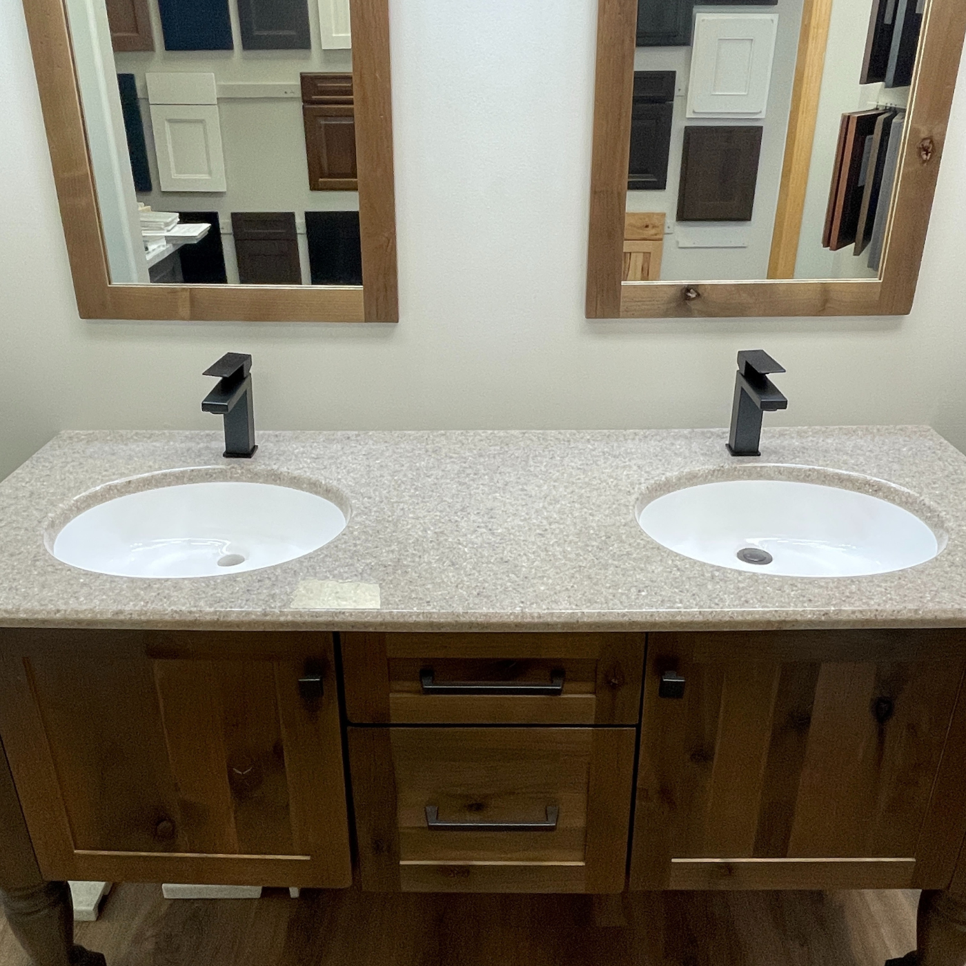 A bathroom with two sinks and two mirrors