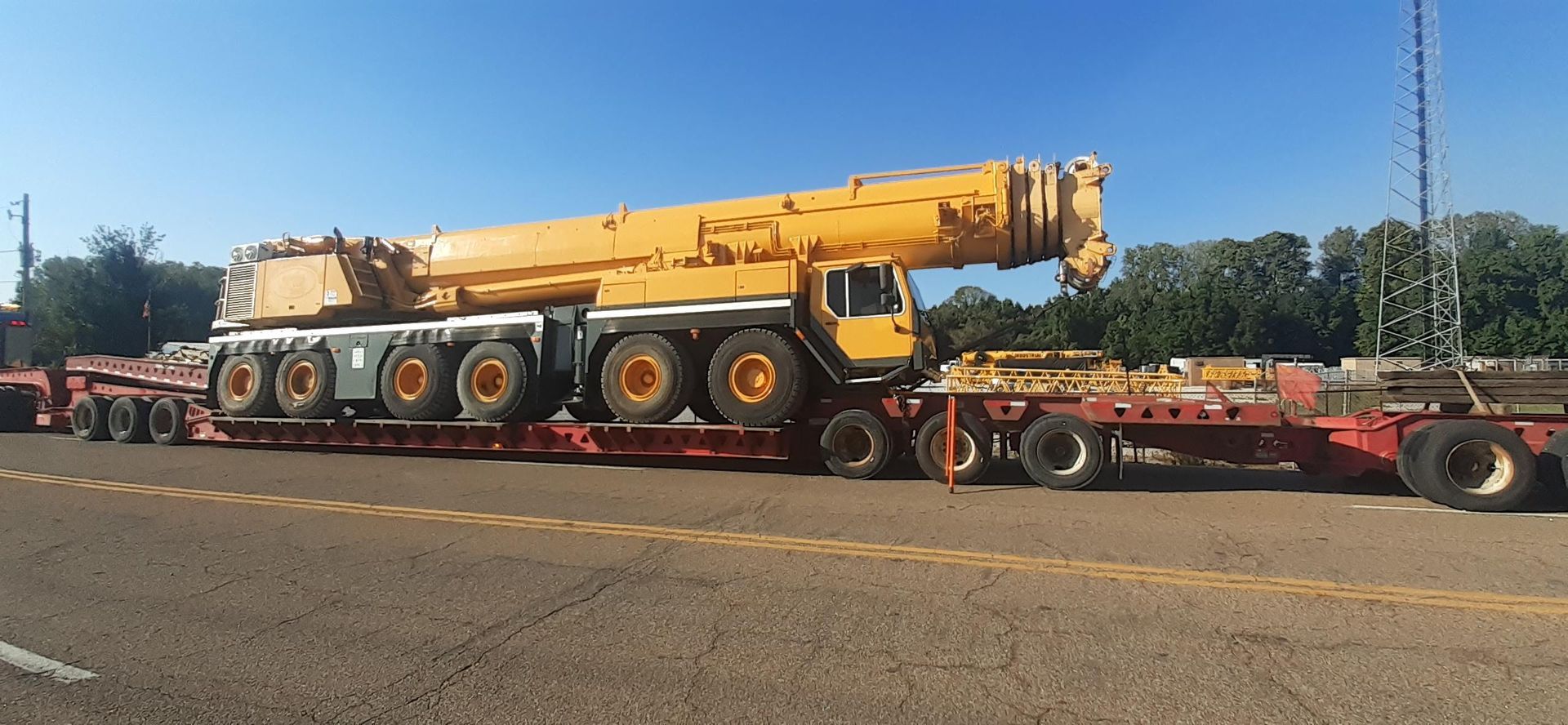 Transporting earth moving equipment