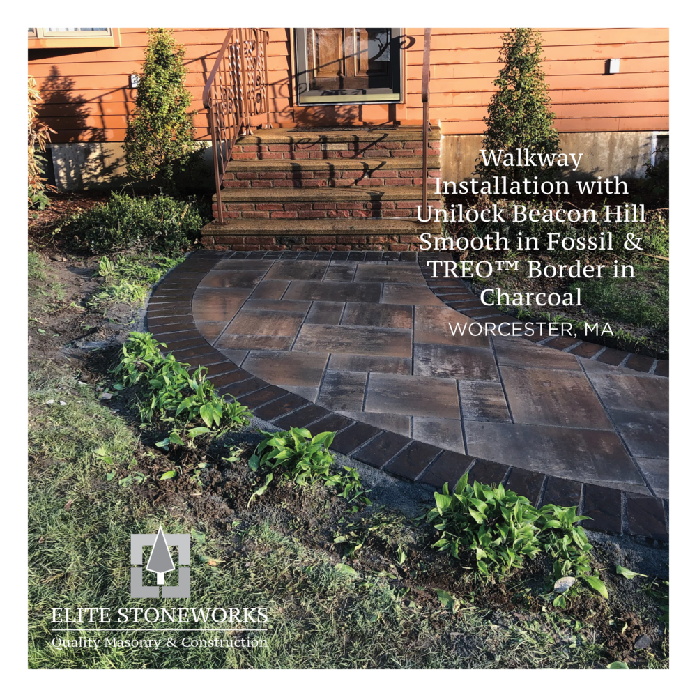 A walkway is being built in front of a house.