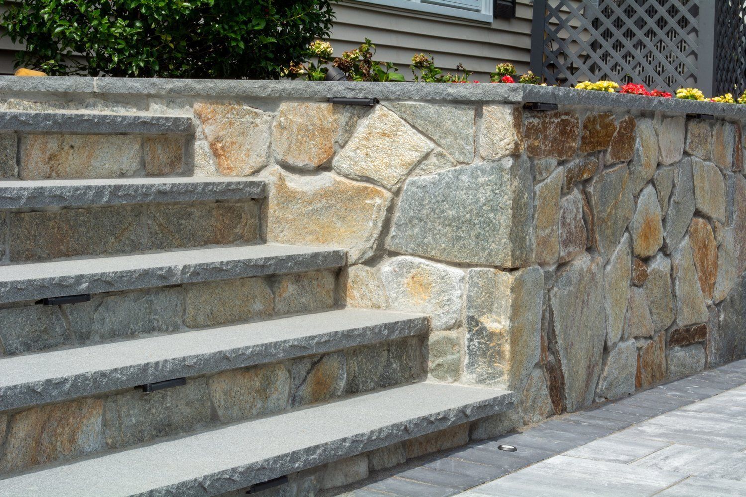 A stone wall with stairs leading up to it