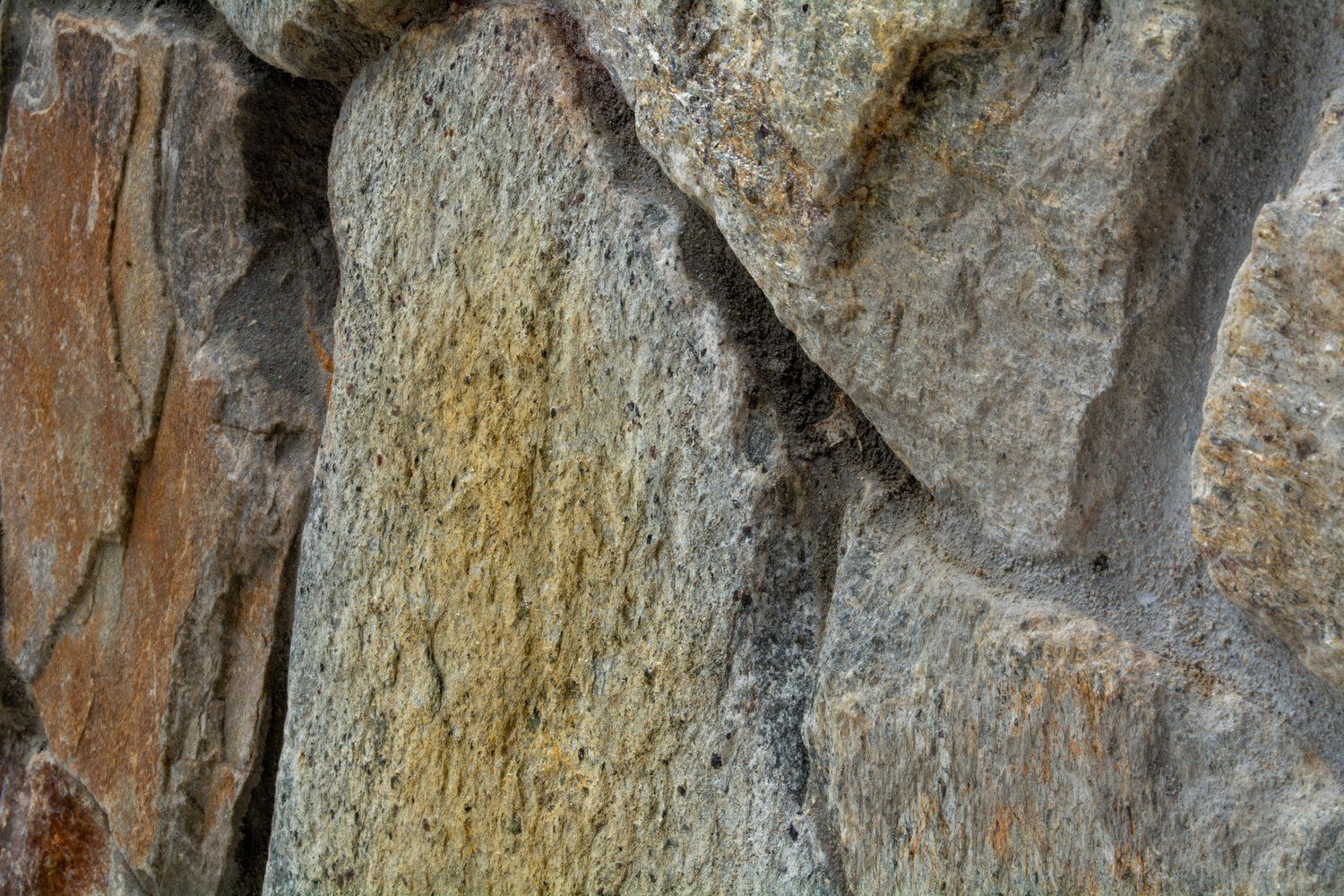 A close up of a pile of rocks on a wall.