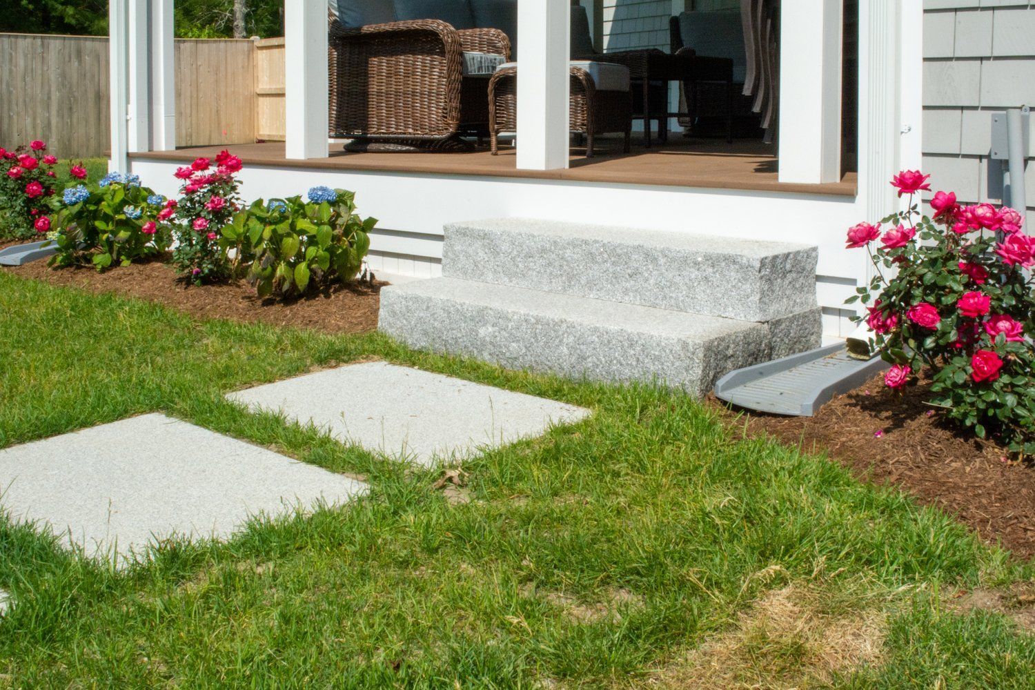 There are steps leading up to the porch of a house.