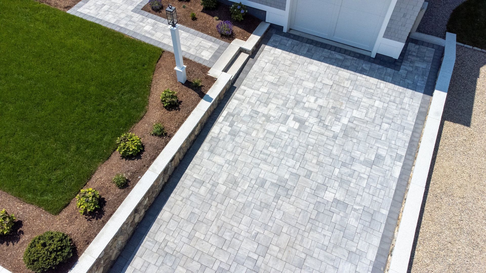 An aerial view of a driveway leading to a house.