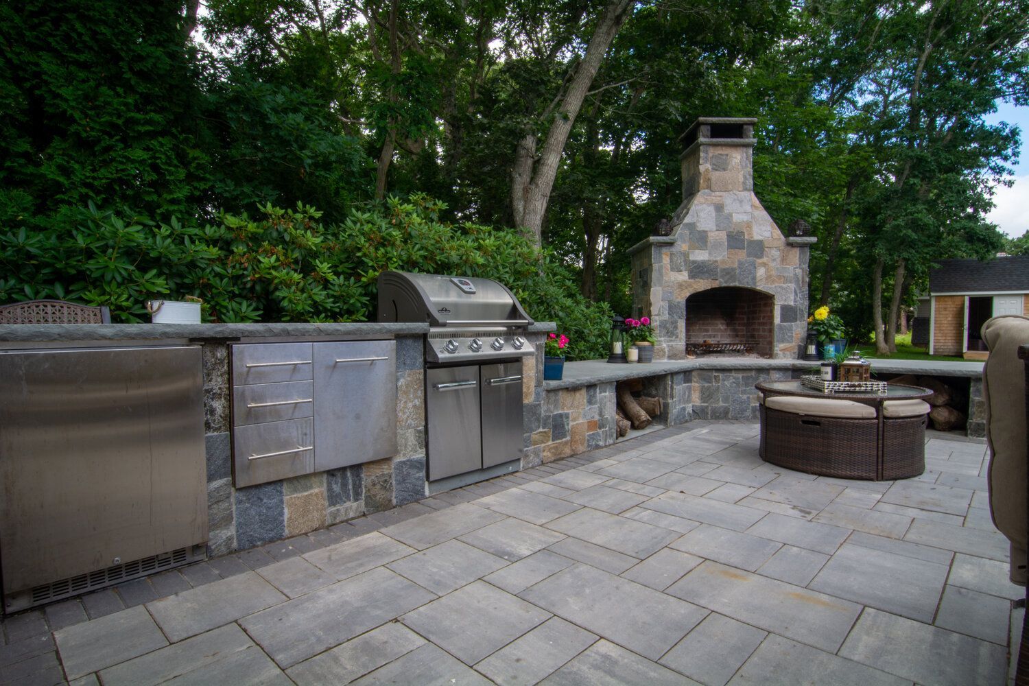 There is a grill and a fireplace in the backyard.
