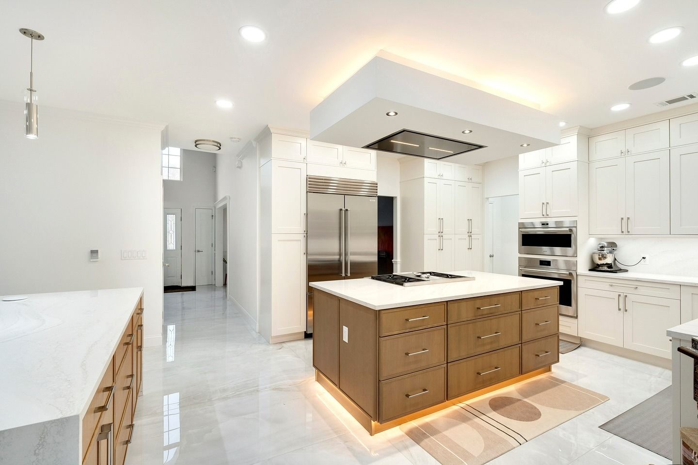 There is a large island in the middle of the kitchen.