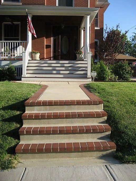 A house with brick steps leading up to the front door