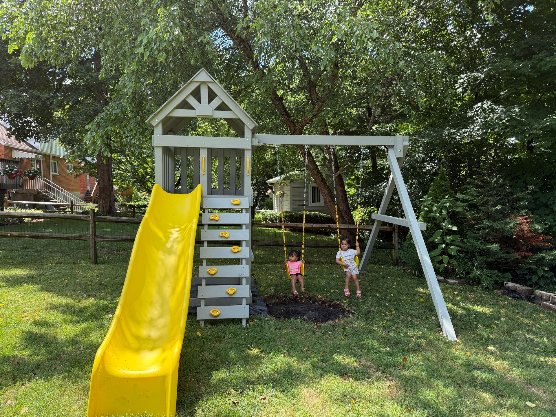 Color chart of solid paint hues. Rows of various shades, from light to dark, including beige, brown, and gray.