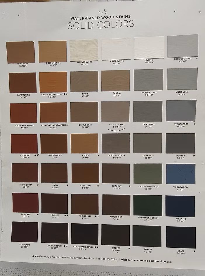 Color chart of solid paint hues. Rows of various shades, from light to dark, including beige, brown, and gray.