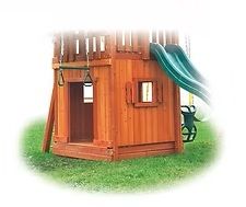 Wooden playset with a green slide, a small window, and a swing bar.