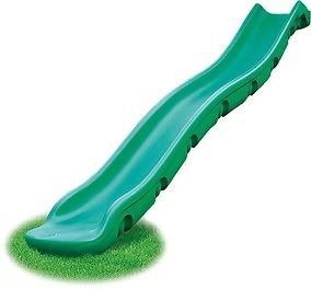 Green plastic slide on a patch of grass.