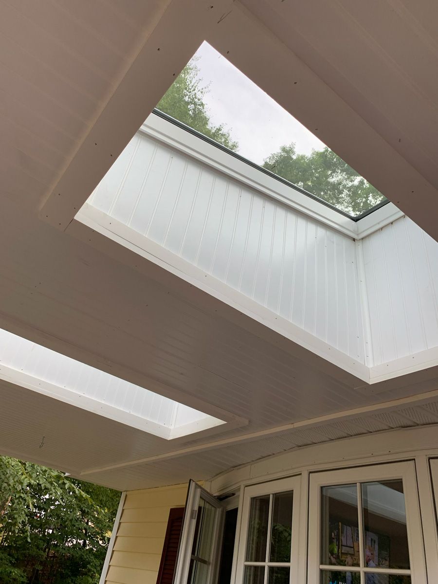 Looking up at a skylight on the ceiling of a house.