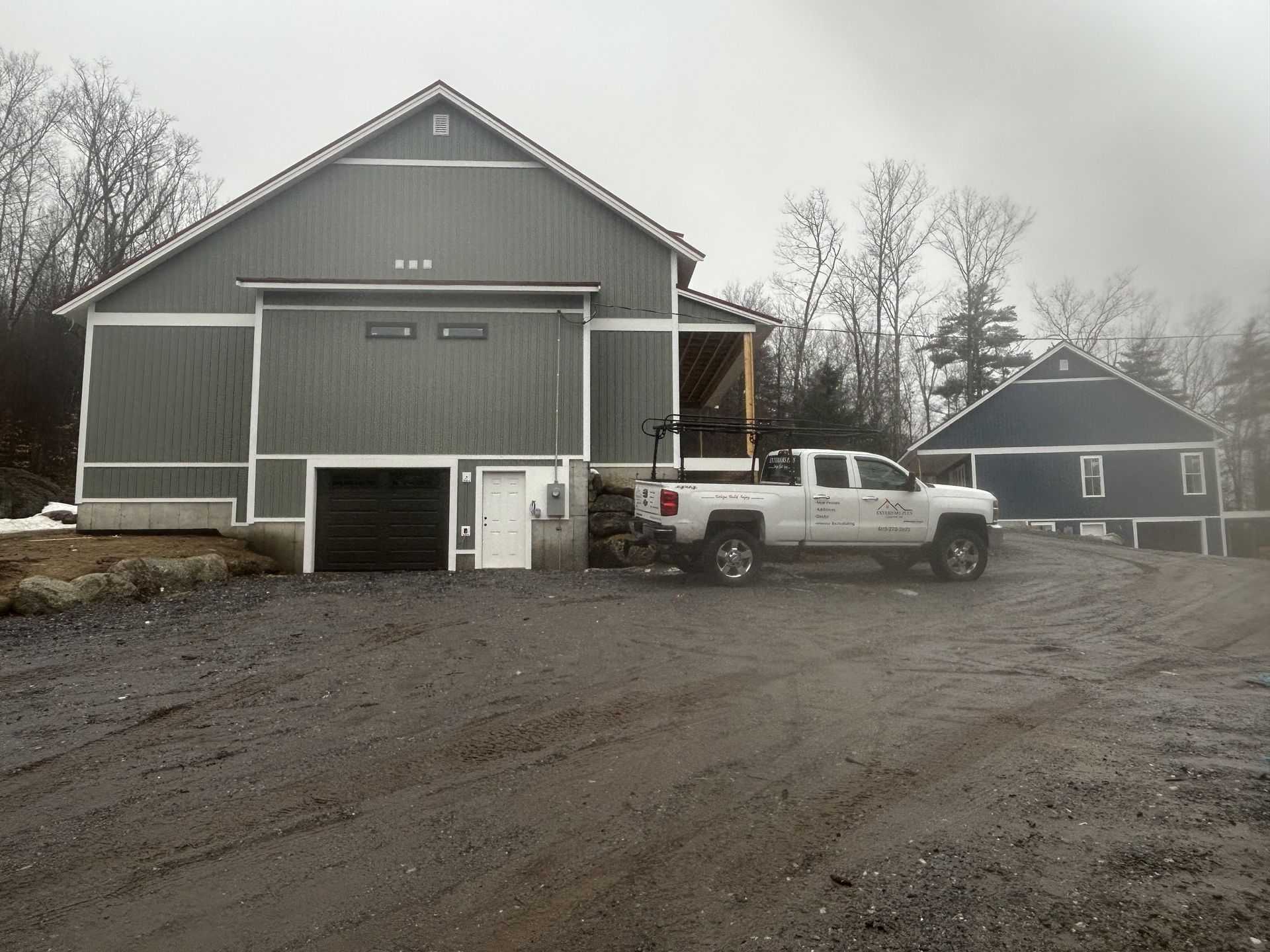 A truck is parked in front of a large building