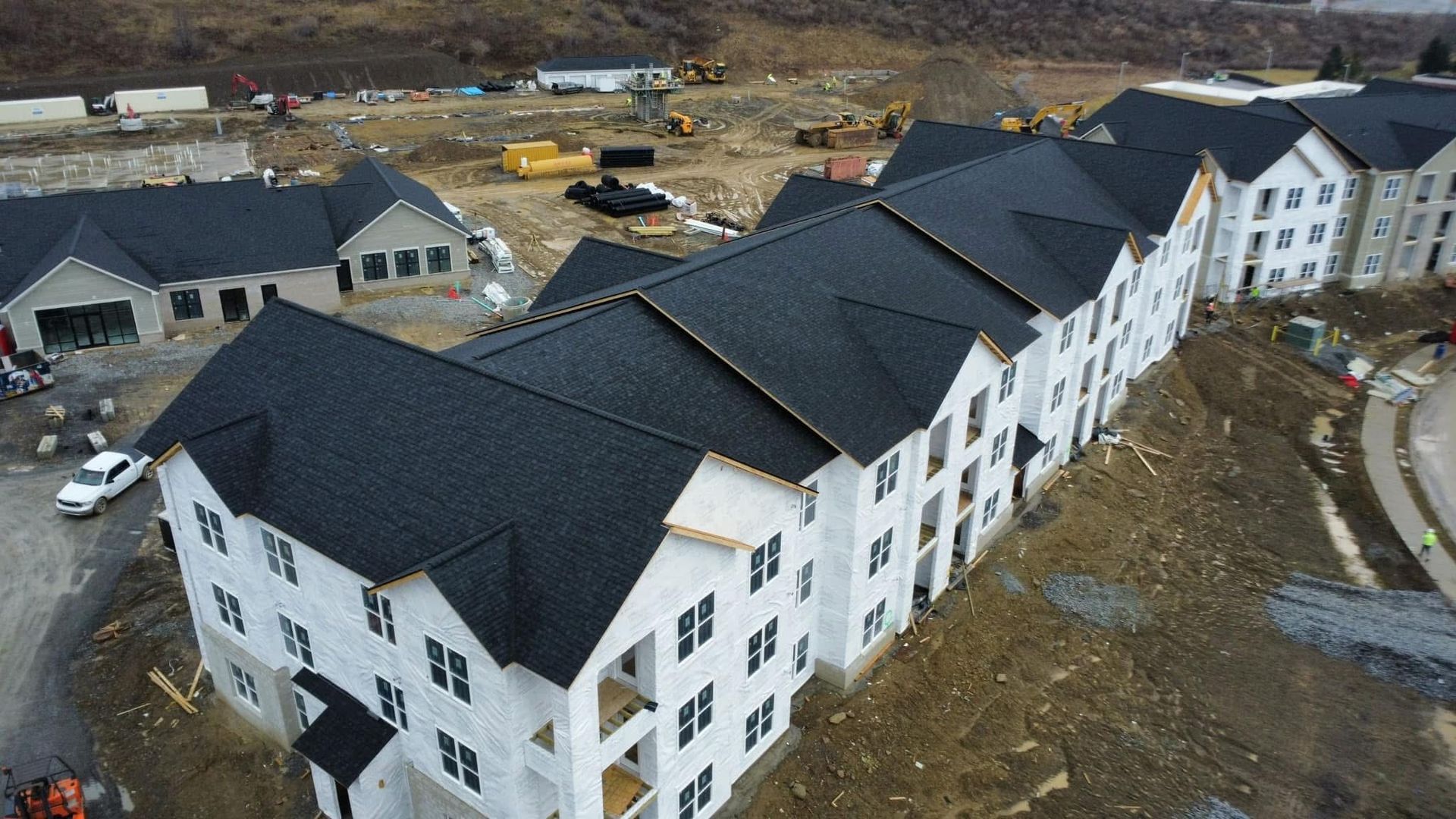 An aerial view of a large apartment building under construction.