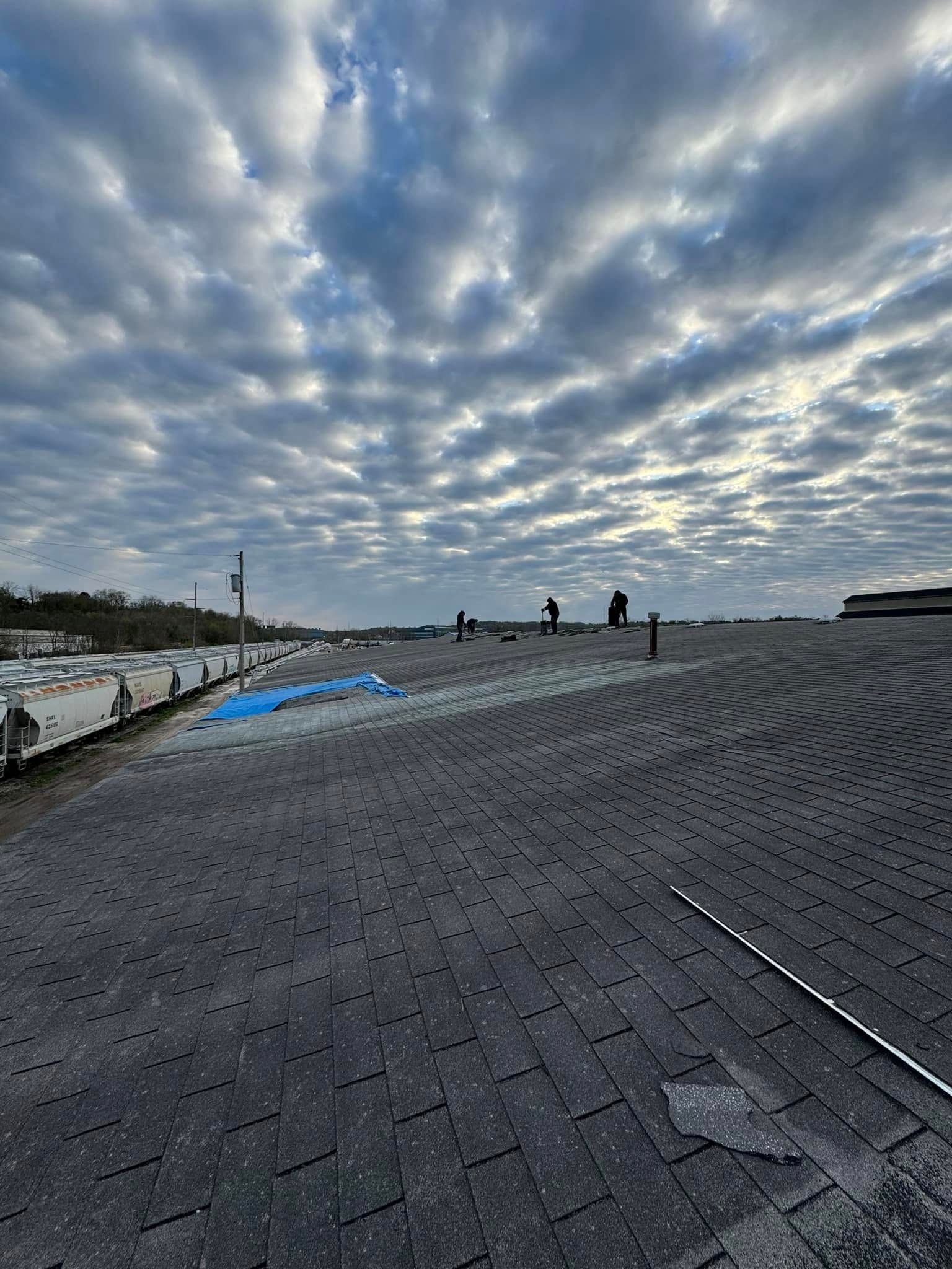 A brick walkway with a cloudy sky in the background.