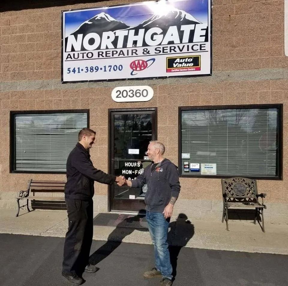 Two men shaking hands in front of 