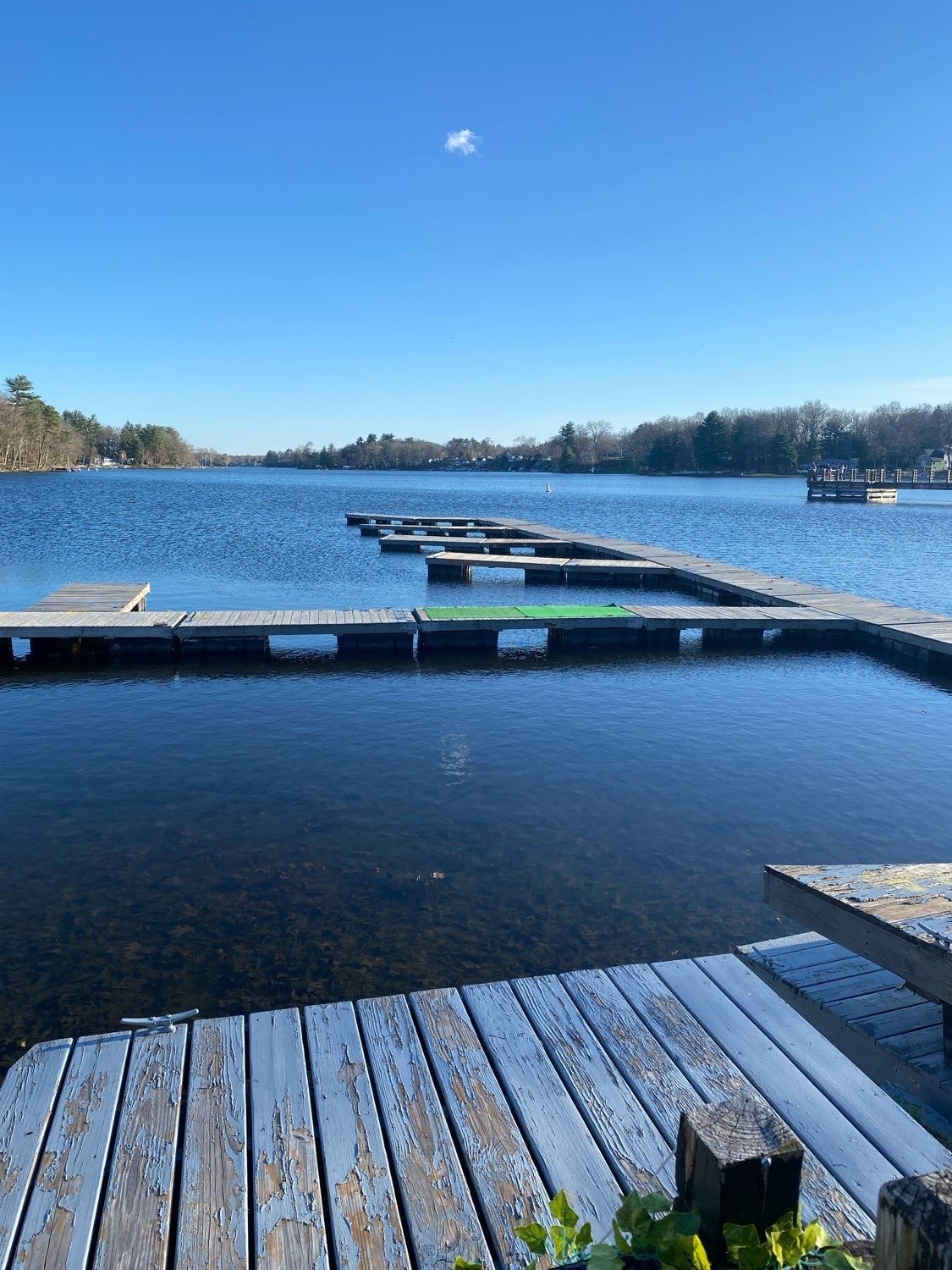 A wooden dock overlooking a large body of water.
