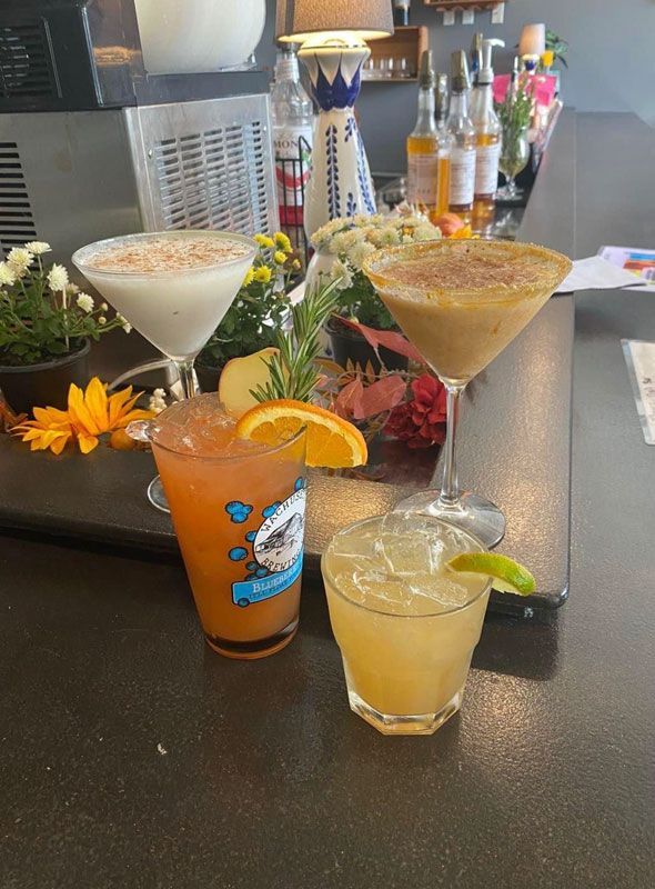 A variety of drinks are sitting on a table.