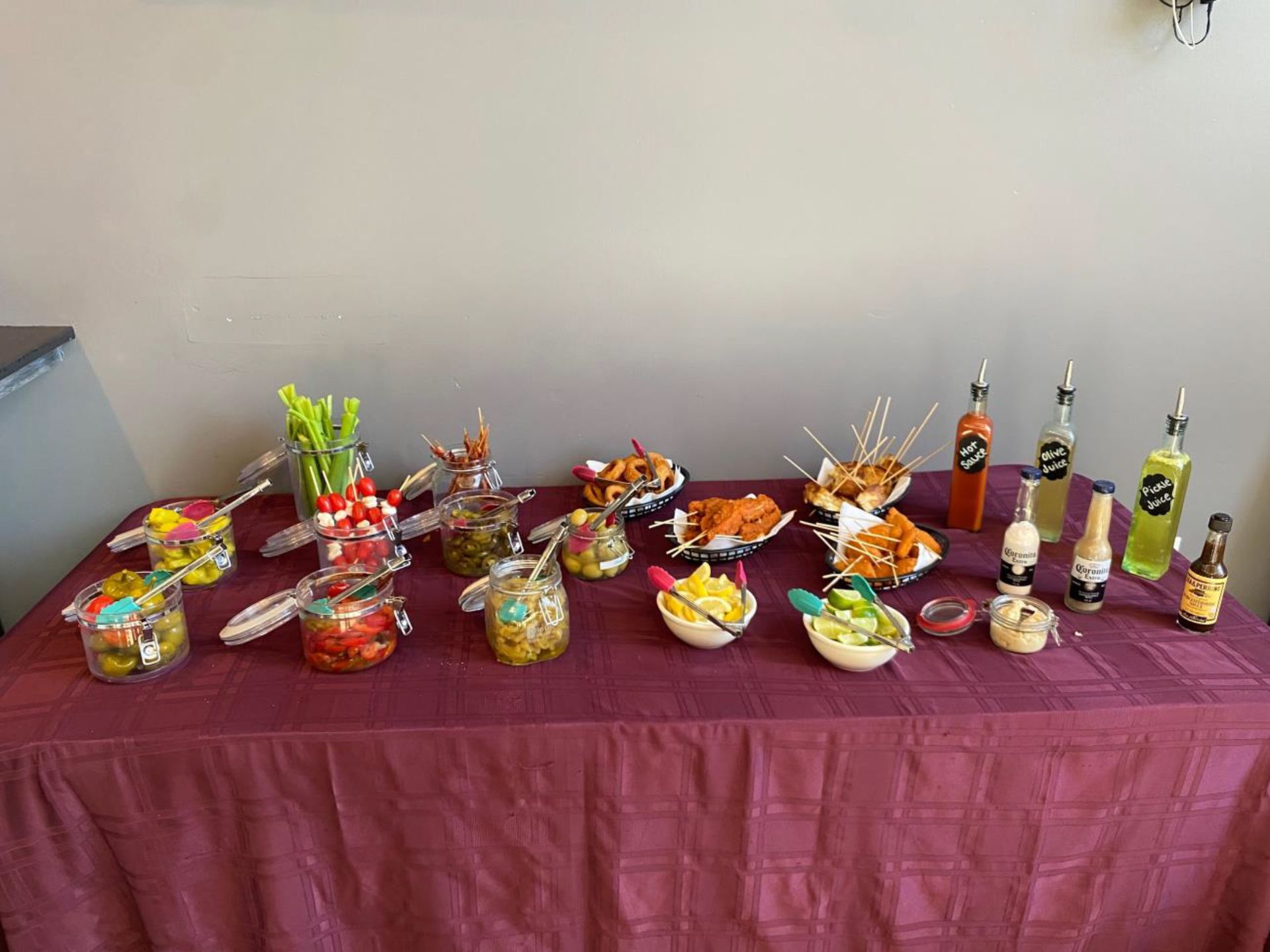 A table with a lot of food and drinks on it.
