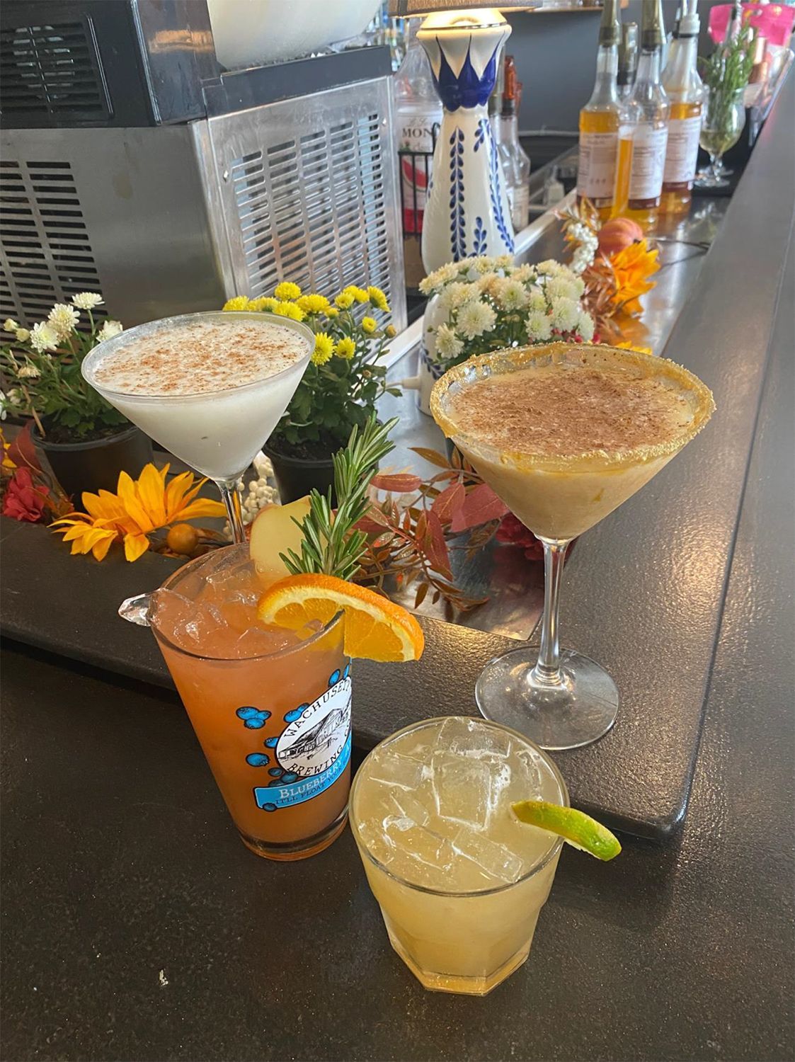 A bar with a variety of drinks on it