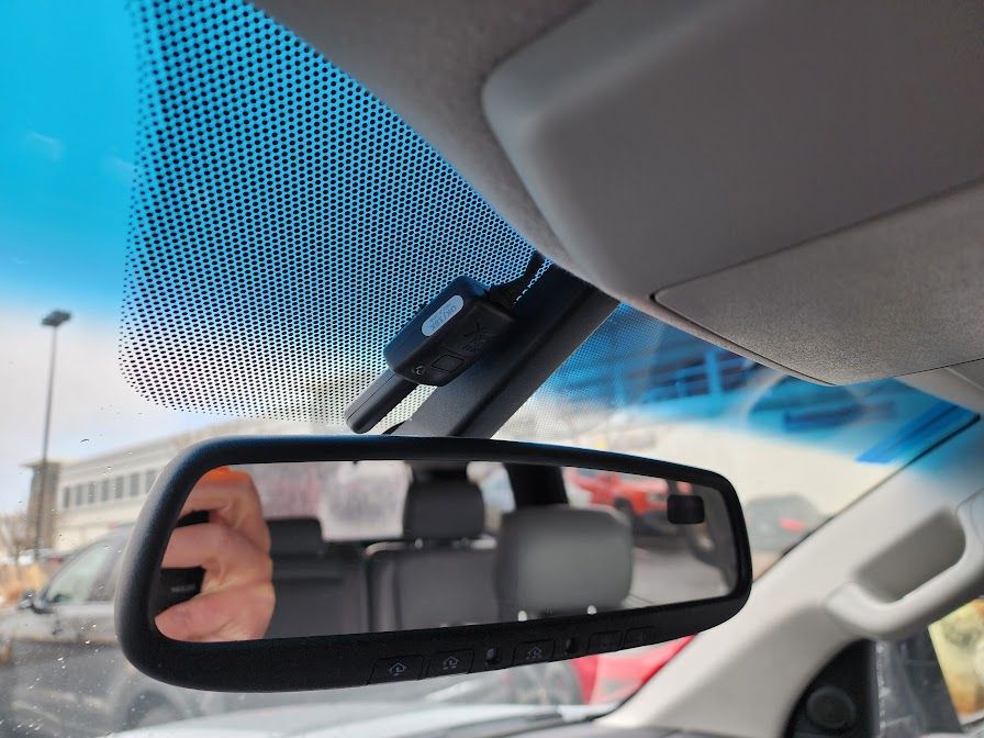 A close up of a car rear view mirror