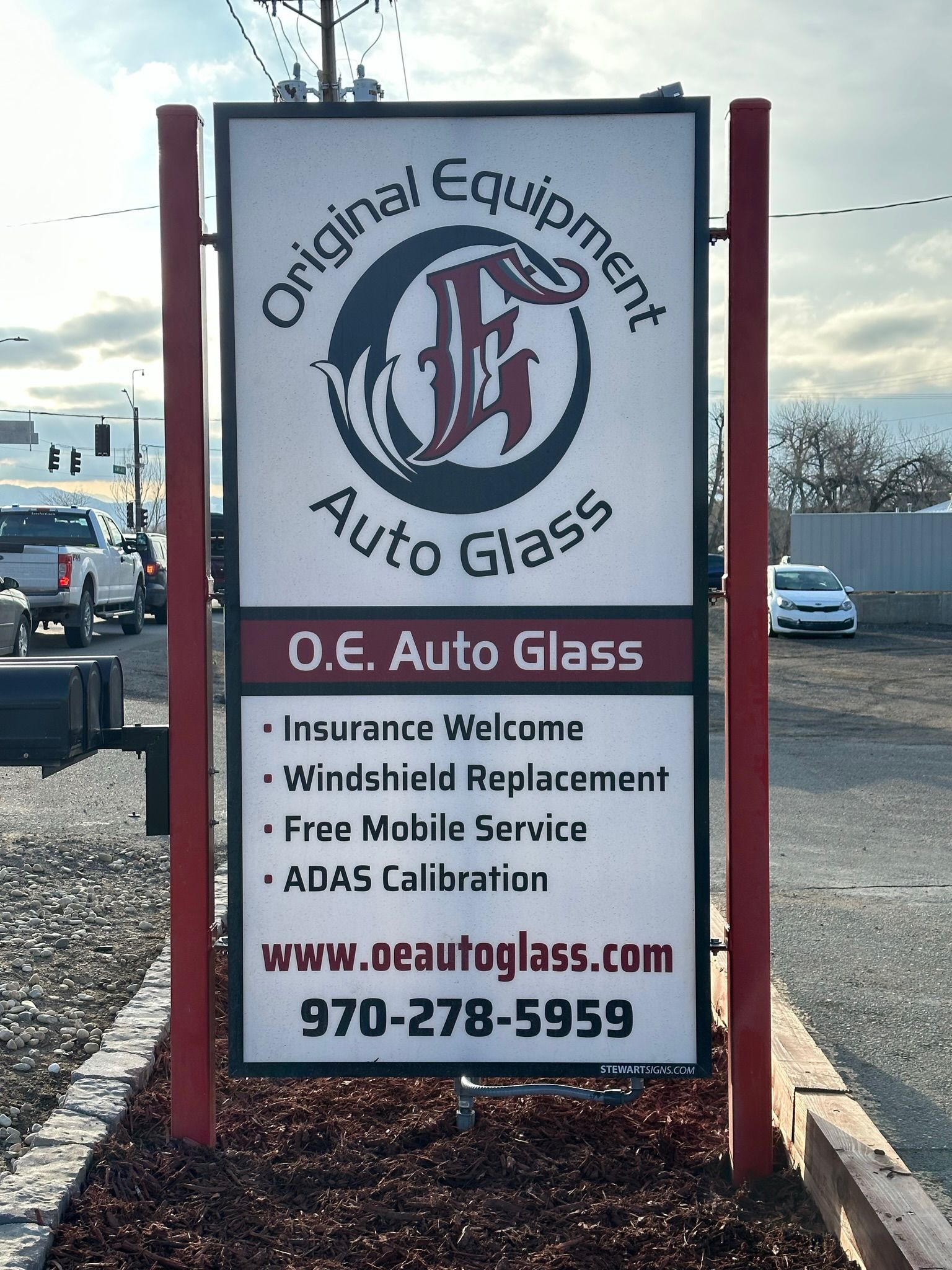 A sign for original equipment auto glass o.e. auto glass