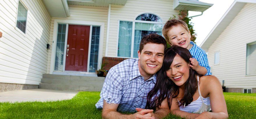 Happy family with their new house