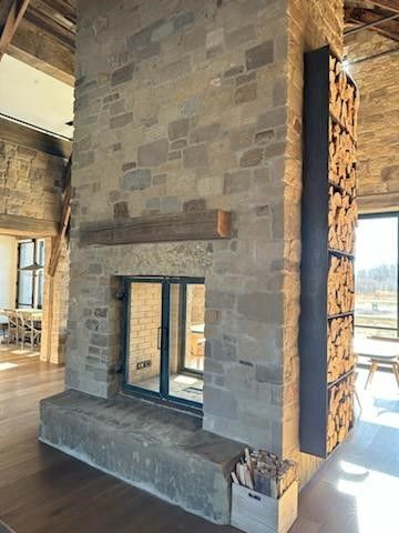 There is a fireplace in the middle of the room