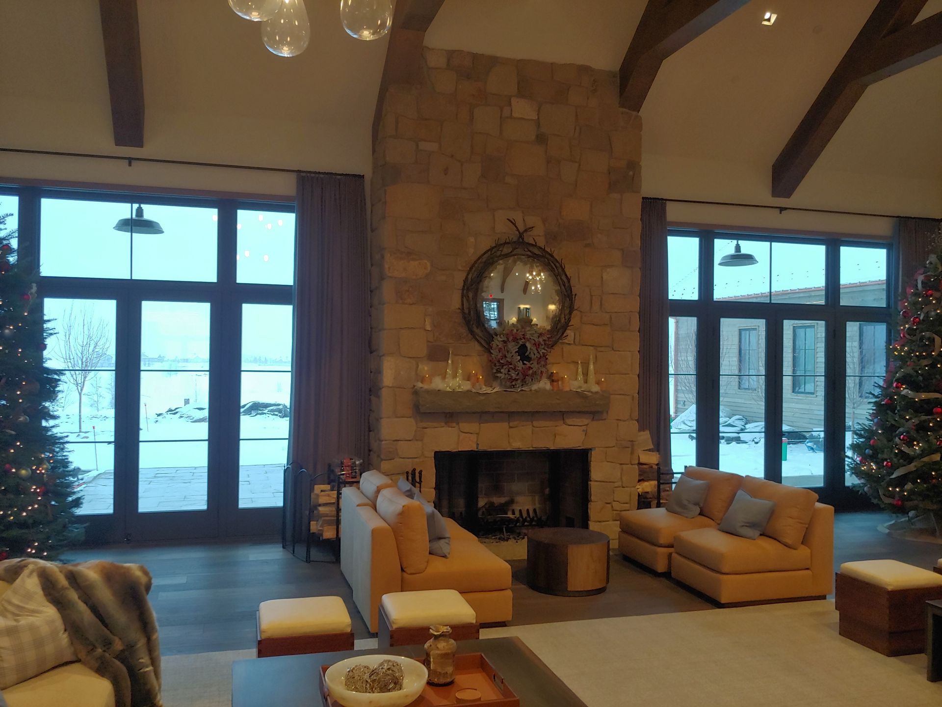 A living room with a fireplace and a christmas tree