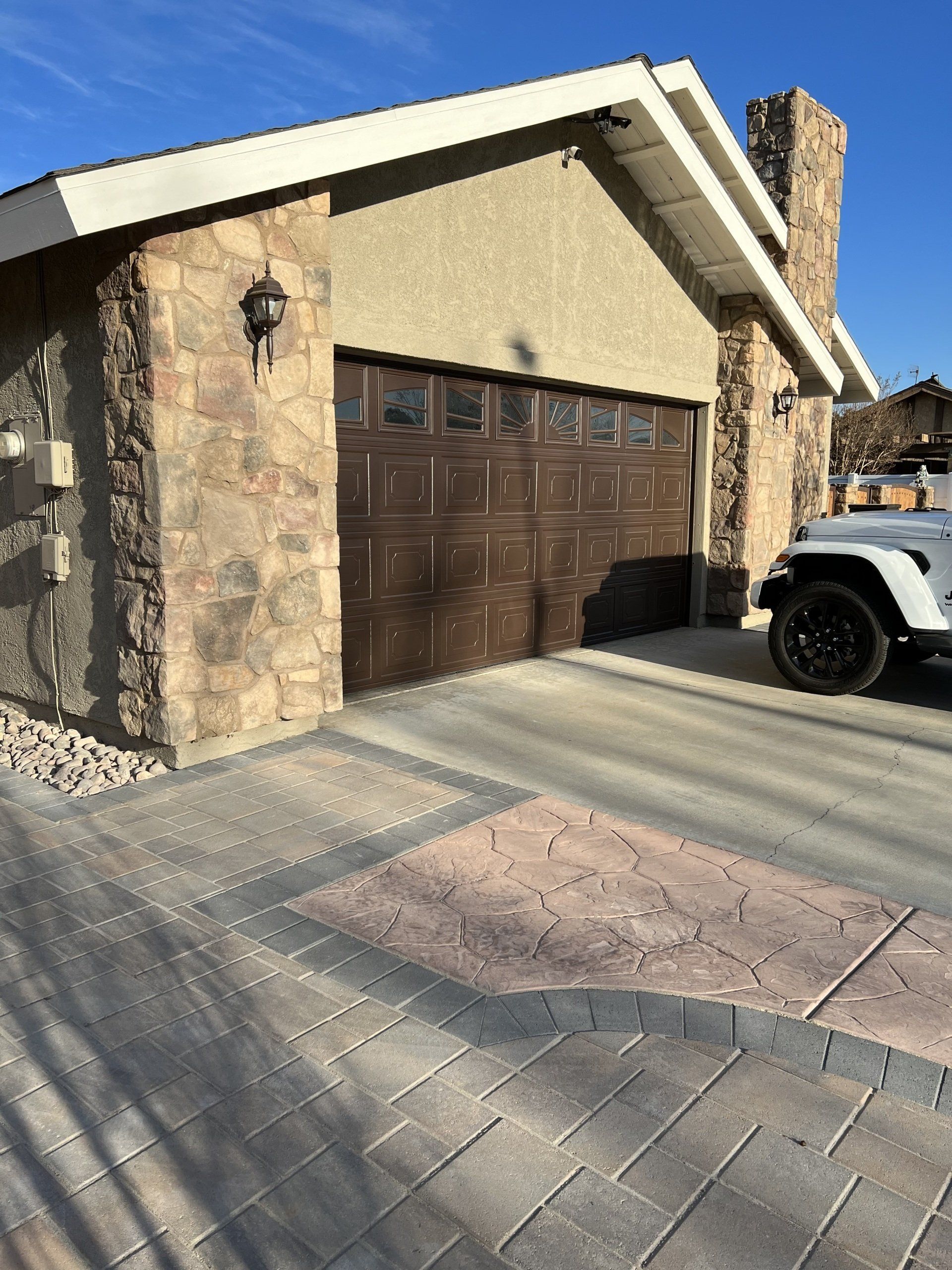 tiled front garage with white car