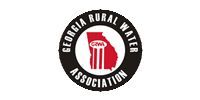 Georgia Rural Water Association circular logo with black, red, and white text and a central water tower icon