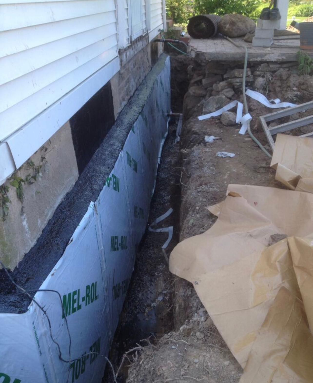 A wall with mel-ax written on it.