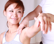 Young woman receives chiropractic