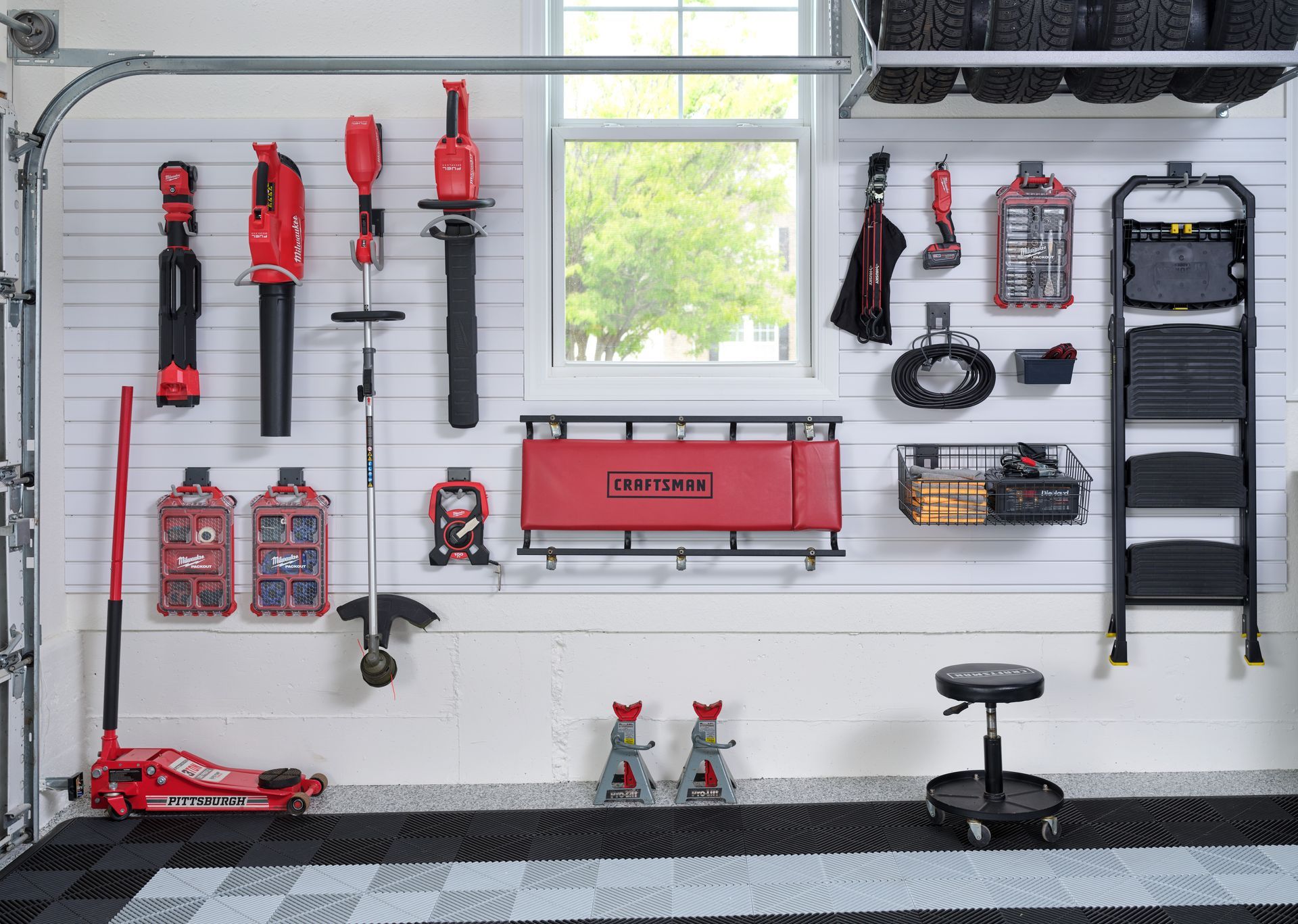 A garage with a lot of tools hanging on the wall.