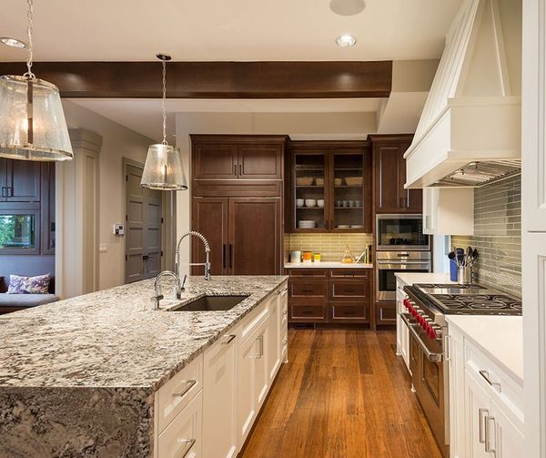 A kitchen with stainless steel appliances and granite counter tops