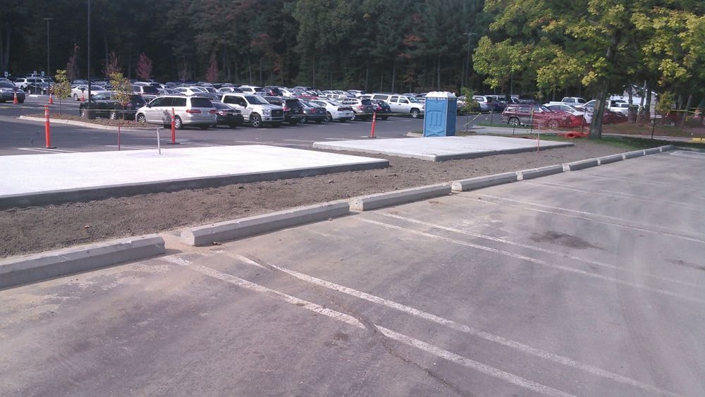 A lot of cars are parked in a parking lot