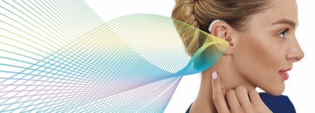 a man and a woman are standing next to each other and smiling